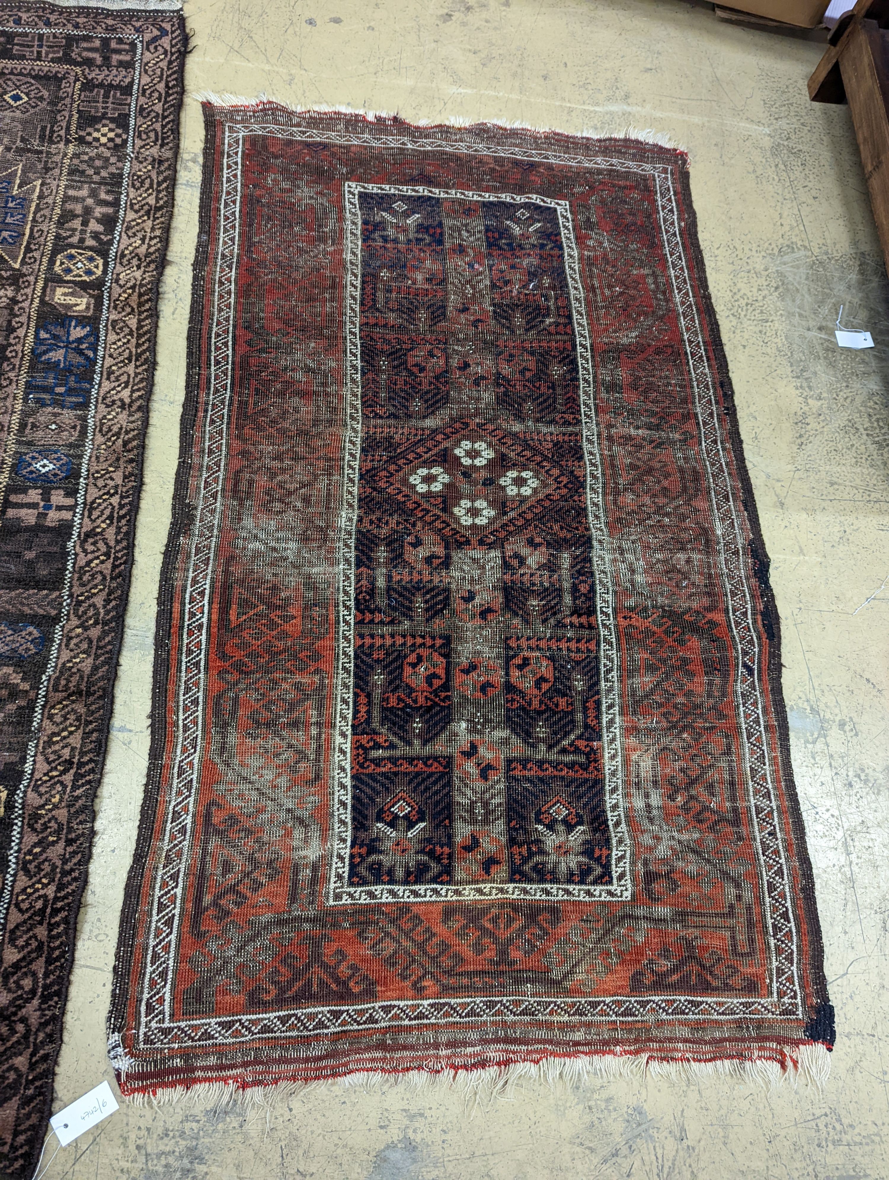 Two Caucasian geometric polychrome rugs, largest 190 x 96cm